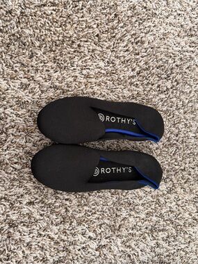 Rothy's Black Slip-On Flats with Blue Trim